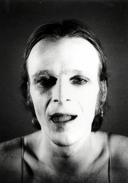 Black and white photograph, self-portrait of the artist with his mouth slightly open and his tongue licking his lips. Jürgen Klauke, Sammlung Goetz Munich